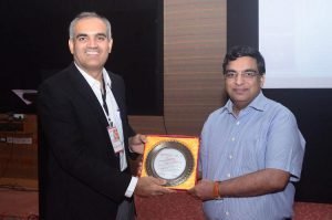 Dr Rajesh Taneja being awarded